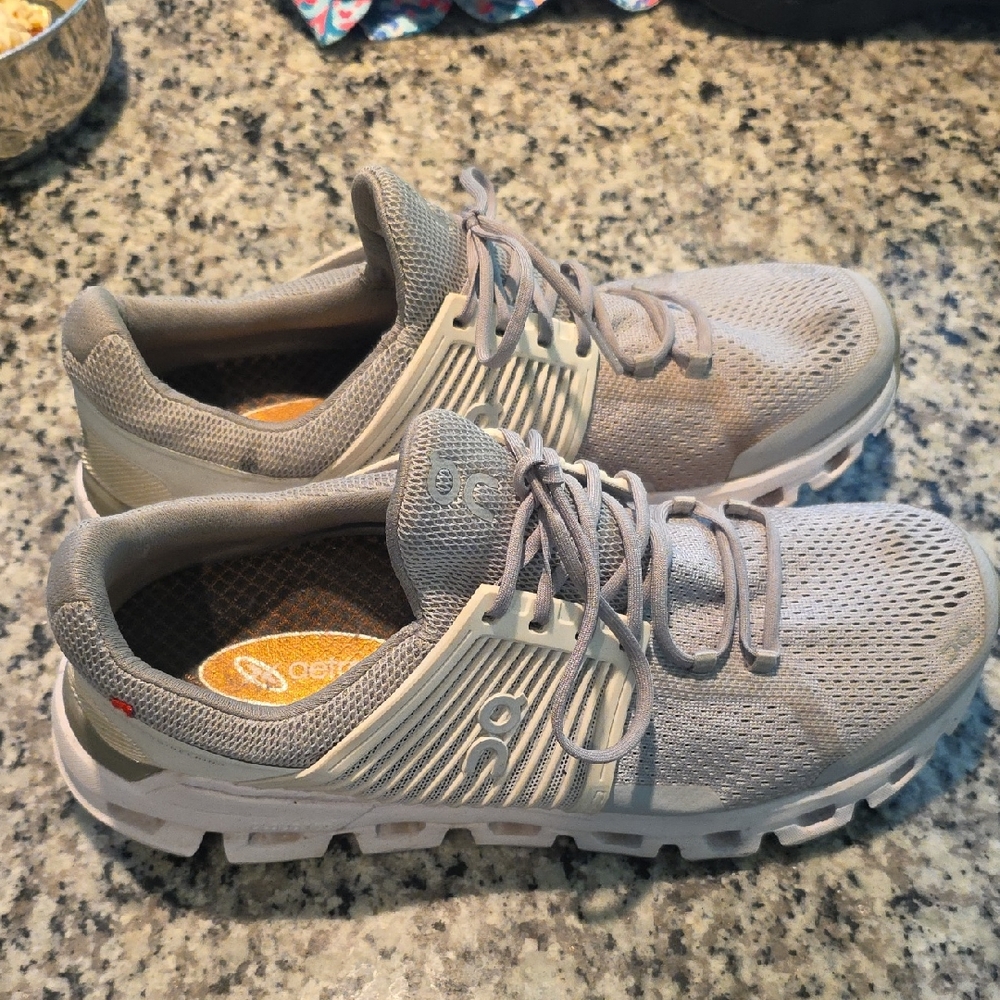 On Running Gray Athletic Shoes with Breathable Mesh and Rugged Soles